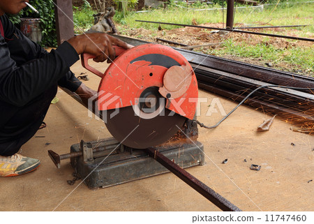 Worker cutting steel rod 11747460