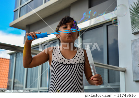 Asian girl enjoying her playing time Asian girl enjoying her playing time 11749610