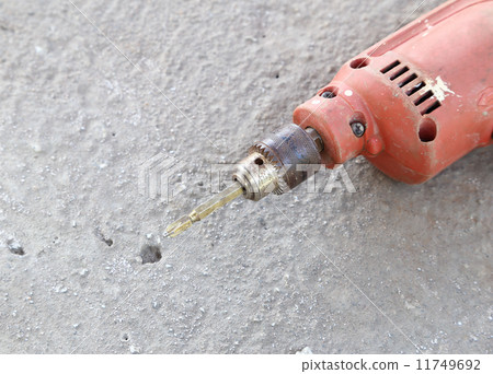old drill with concrete 11749692