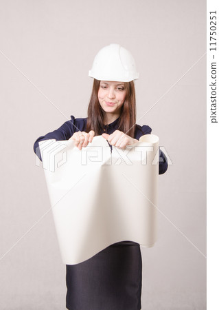 Woman architect in helmet drawing tears 11750251