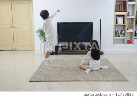 Funny child watching 4k large digital TV Funny child watching 4k large digital TV 11750826