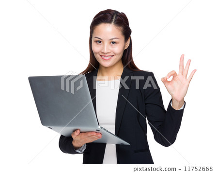 Business woman with laptop computer and hand with ok sign Business woman with laptop computer and hand with ok sign 11752668