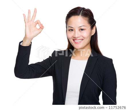 Business woman showing OK hand sign 11752676