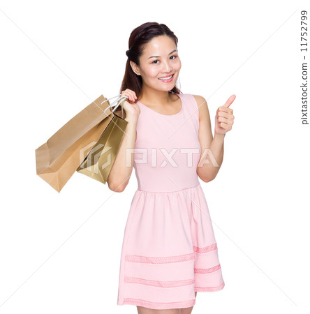 Woman with shopping bag and thumb up Woman with shopping bag and thumb up 11752799