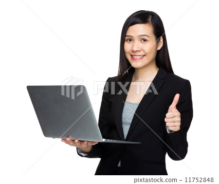 Asian business woman with laptop computer and thumb up Asian business woman with laptop computer and thumb up 11752848