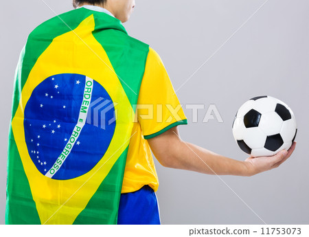 Backview of football player wear with Brazil flag and hold footb 11753073
