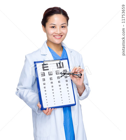 Female doctor with eye chart and glasses 11753659