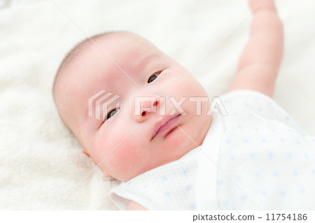 Baby son lying on bed Baby son lying on bed 11754186