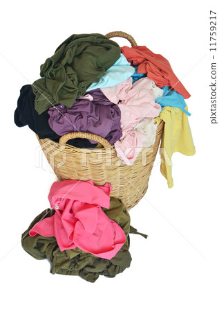 pile of colorful shirts in a wicker basket 11759217