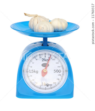 kitchen scales and garlic isolated on white background kitchen scales and garlic isolated on white background 11760317