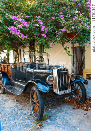 Cobblestone street and old car in Historic neighborhood in Colon 11761567