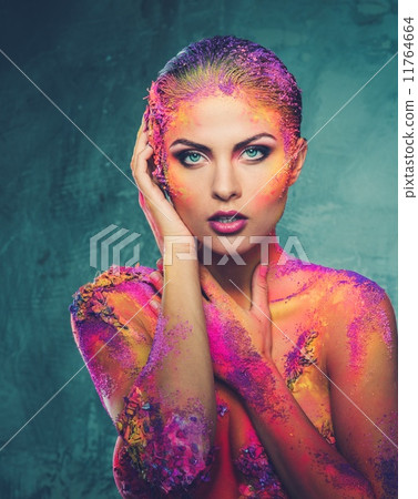Beautiful young woman with conceptual colourful body art 11764664