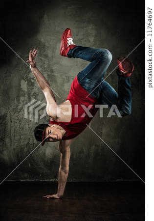 Man dancer showing break-dancing moves 11764697