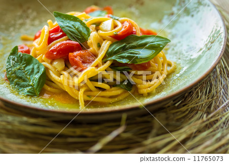 Homemade pasta with Basil and tomatoes 11765073