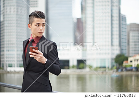Businessman Texting in the City Businessman Texting in the City 11766818