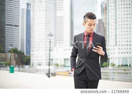Businessman Texting in the City 11766849