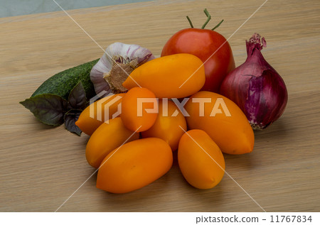 Yellow tomatoes on the board 11767834