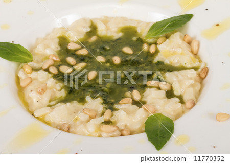 photo of delicious risotto dish with herbs and cedar nut on whit 11770352