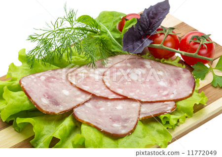 Sausages with salad and basil 11772049