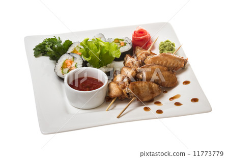 Buffalo chicken wings on plate with sushi Buffalo chicken wings on plate with sushi 11773779