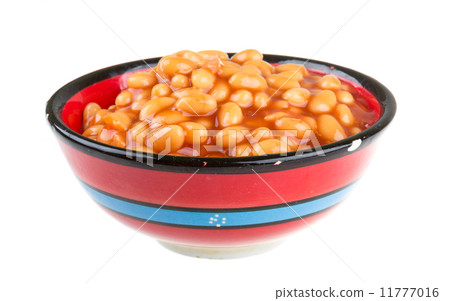Marinated haricot beans in tomato sauce with shallots on a plate 11777016