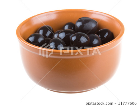 Olives black watered with olive oil in a bowl isolated on a whit Olives black watered with olive oil in a bowl isolated on a whit 11777606