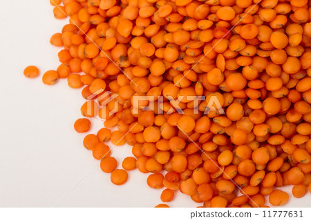 Heap of raw red lentils isolated on white background Heap of raw red lentils isolated on white background 11777631
