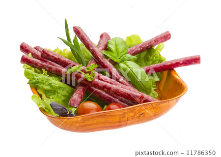 Ripe salami with salad, basil, onion and tomato Ripe salami with salad, basil, onion and tomato 11786350