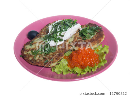 Roasted cutlets of potato with salmon on a plate 11790812