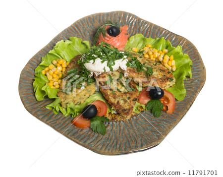 Roasted cutlets of potato with salmon on a plate 11791701