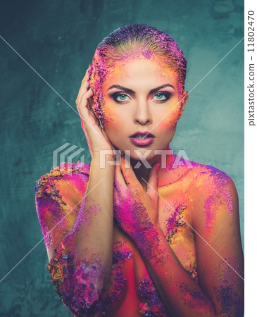 Beautiful young woman with conceptual colourful body art 11802470