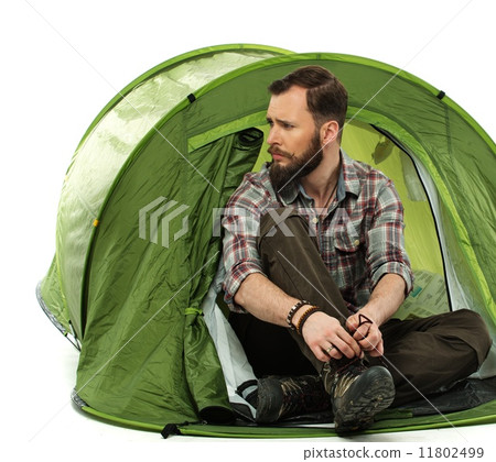 Handsome traveler in a tent Handsome traveler in a tent 11802499