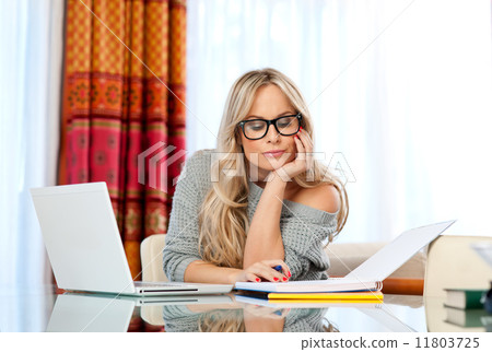 attractive woman writing on laptop 11803725