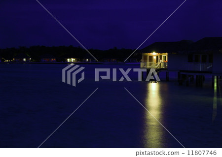 Night view of water cottage 11807746