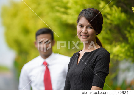 Mix race of young successful Indian Malay corporate execute team outdoor portrait Mix race of young successful Indian Malay corporate execute team outdoor portrait 11809241