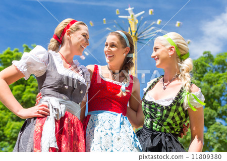 Friends visiting Bavarian folk festival 11809380