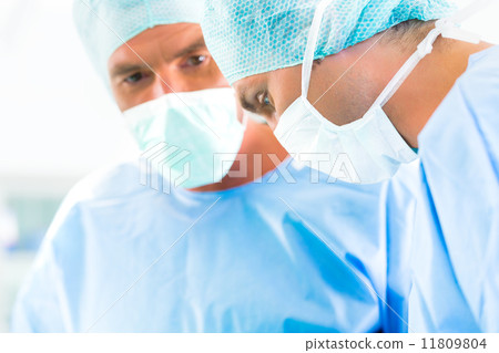 Surgeons or doctors in operating room of hospital 11809804