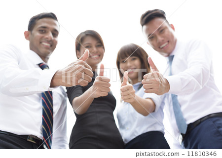 Successful young asian mixed race corporate executive showing off team work thumbs up thumb in focus 11810346