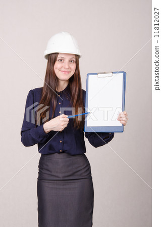 Beautiful girl shows a pencil inscription on folder Beautiful girl shows a pencil inscription on folder 11812027