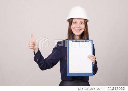 Girl a helmet standing with folder in hand 11812032