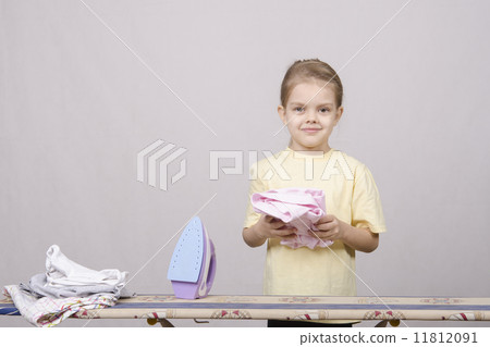 the girl finished ironed clothes iron 11812091