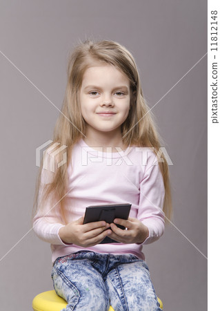 Portrait girl with a small mirror in hands of 11812148