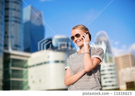 Confident business woman speaking on the phone Confident business woman speaking on the phone 11816823