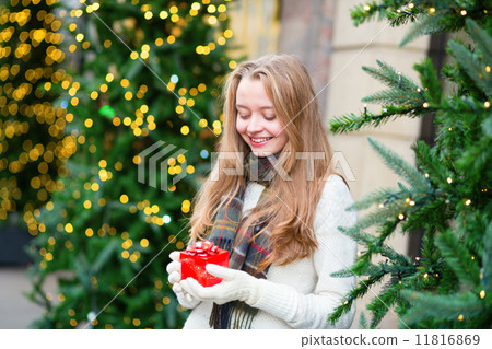 Girl with a Christmas present 11816869