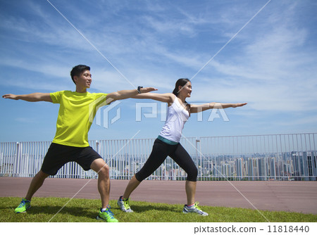 Young Asian Adults practising yoga in the city 11818440