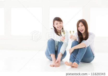 Two women drinking wine Two women drinking wine 11820343
