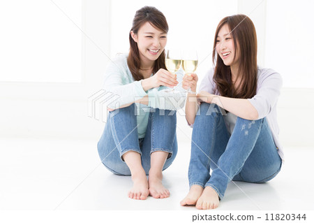 Two women drinking wine Two women drinking wine 11820344