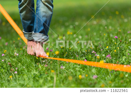 Slack line in the city park. Slack line in the city park. 11822561