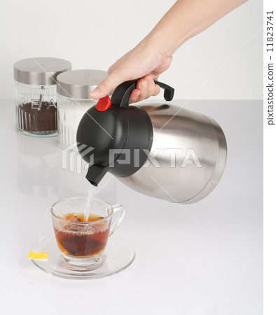 Pouting hot water into the cup of tea 11823741