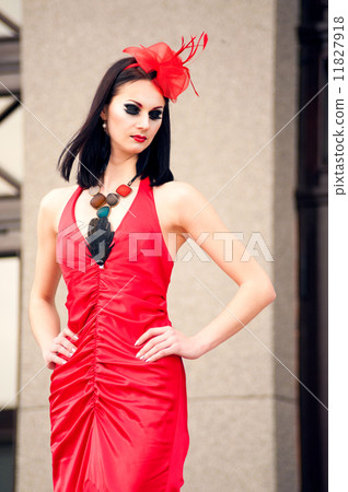 Beautiful young woman in a red dress 11827918